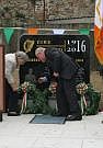 Ita Doyle and Tony Walshe lay a wreath on
                        behalf of the family